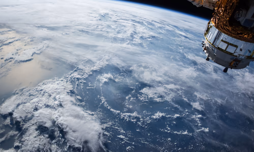 Satellite orbiting Earth representing Amazon's $11.57 billion acquisition of Globalstar and the launch of Amazon Leo to compete with SpaceX Starlink for global satellite internet dominance