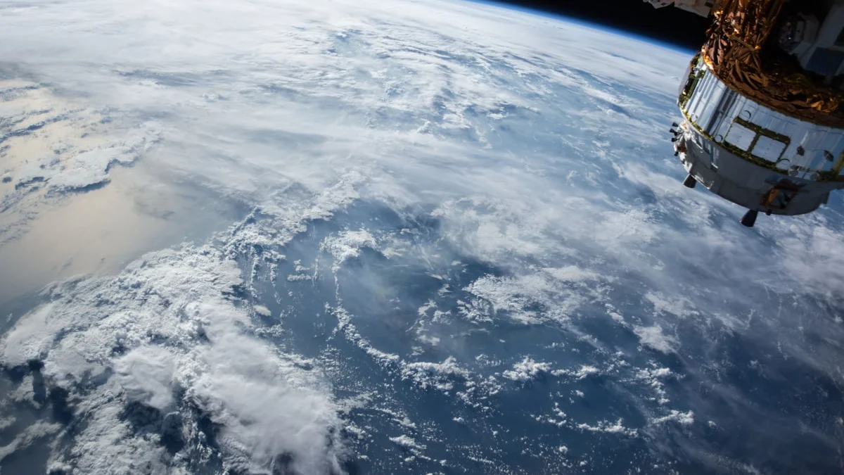 Moon surface photographed from space representing the Artemis II crewed lunar flyby mission with astronauts Reid Wiseman Victor Glover Christina Koch Jeremy Hansen returning to Earth April 2026