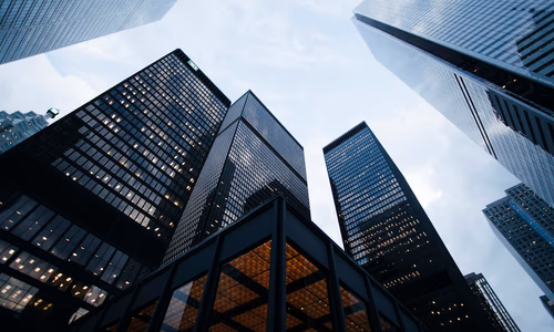 A modern corporate skyline representing the changing landscape of work and the global economy.