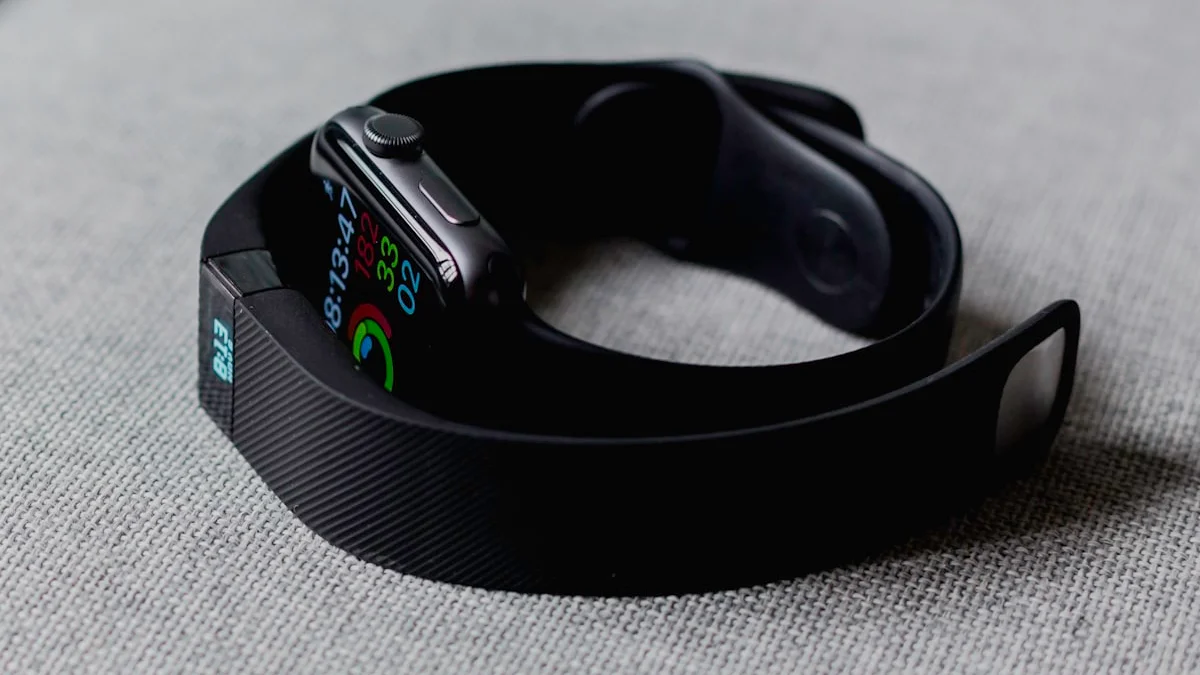 Smartwatch and smartphone showing wellness data while a Google Health interface overlays the screen, representing Fitbit rebrand
