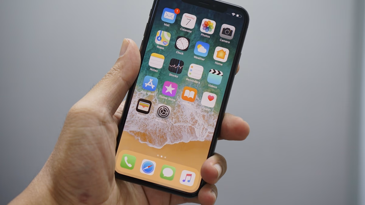 An iPhone with a security lock icon representing Lockdown Mode.