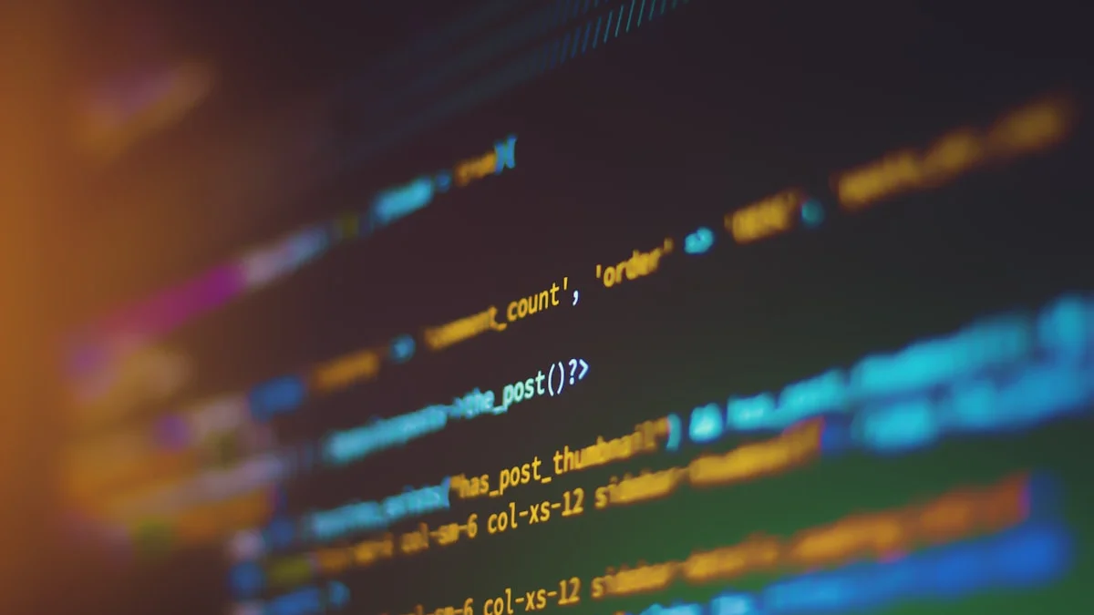 A developer's dual-monitor workstation with code on one screen and AI model output on the other, bathed in soft blue light — representing the local open-source AI development environment where models like Gemma 4 and Llama 4 Scout run entirely on personal hardware without sending data to external servers.