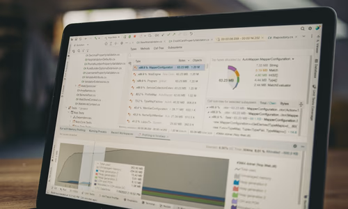 Laptop screen showing a browser and AI interface while a background download progresses, representing Chrome quietly downloading a large AI model